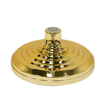 Gold-colored lampshade finial on a white background