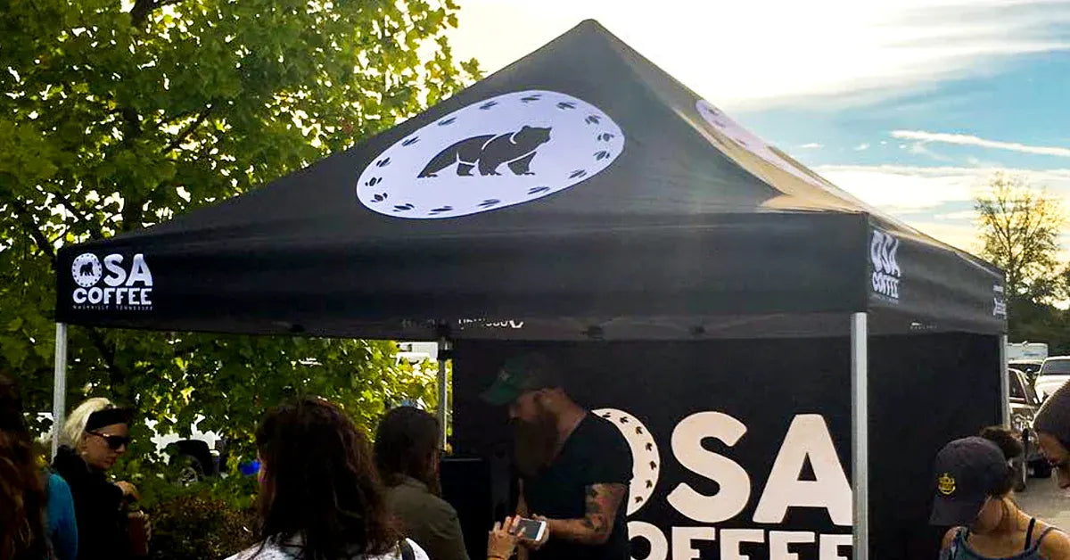 OSA Coffee tent with people around at an outdoor event