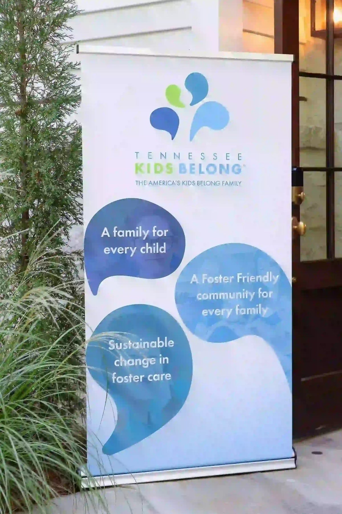 Tennessee Kids Belong banner with text and logo outdoors